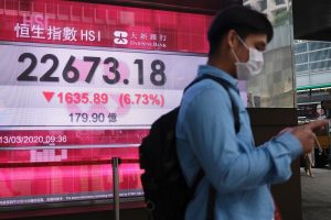 Asia equities turn negative as virus economic reality bites