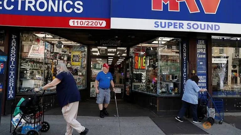 US consumer spending rises for second straight month, income drops further