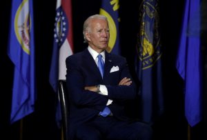 Trump grabs spotlight but reclusive Biden leads US polls