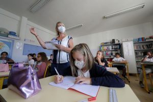 Texts books and face masks, Europe’s children return to school