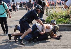 Police break up fights between demonstrators and arrest two outside Portland, Oregon