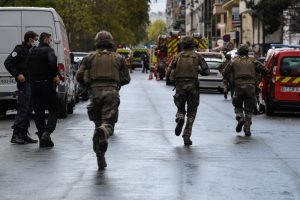 Four stabbed in Paris attack, suspect arrested, say officials