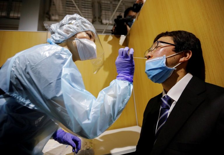 Japan finds new Covid-19 strain, while immigration centre reports infections