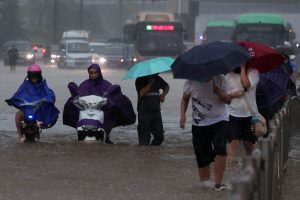 12 dead in flooded subway as downpours hit central China, say officials