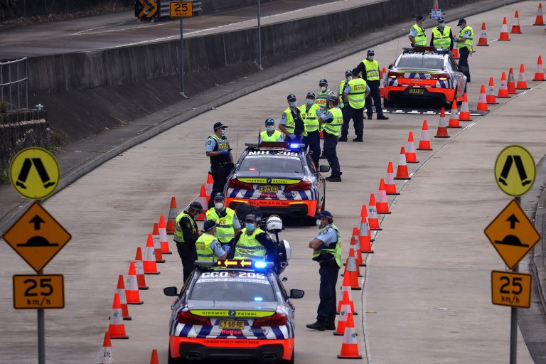 Australia reports record COVID-19 cases as police block Sydney protest