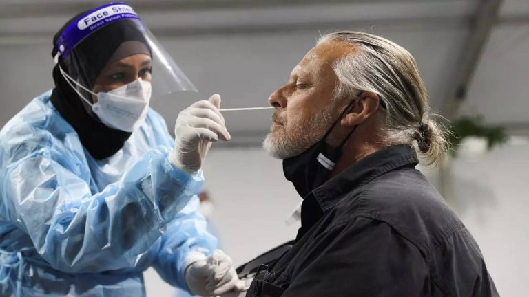 Australia relaxes testing rules amid Omicron surge