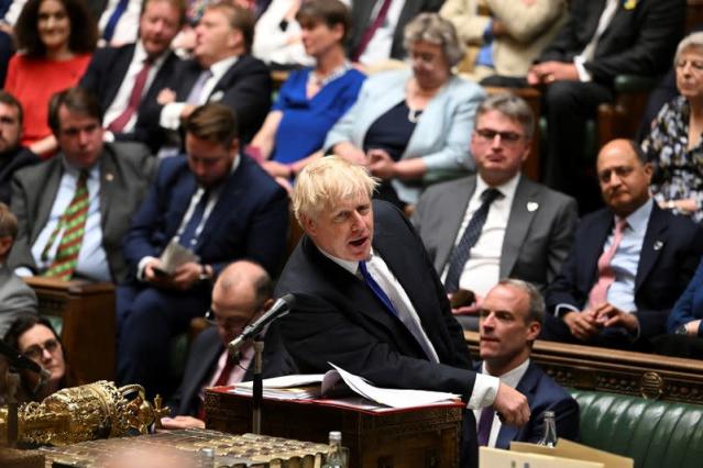 Boris Johnson digs in as ministers, lawmakers desert UK government