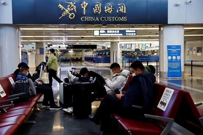 China ends Covid quarantine for travellers in January