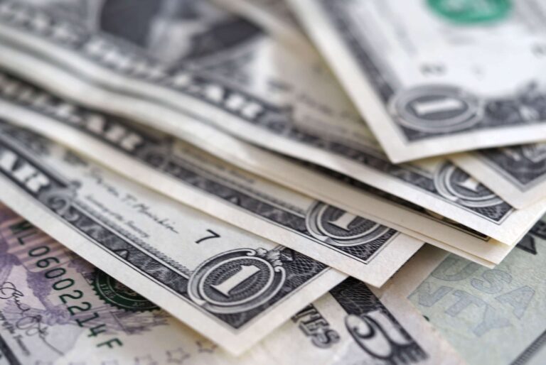 Dollar buoyant; yuan wobbles after China cuts lending benchmarks