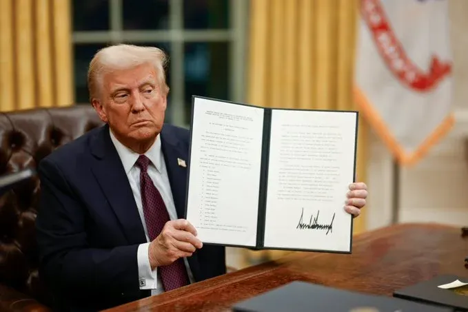 Trump signs orders curbing funding for migrants, eliminating regulations